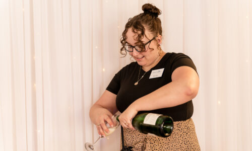 A server pours champaign at a Maumee Bay wedding