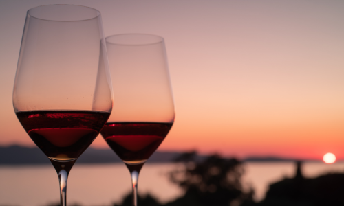 Two glasses of wine at sunset