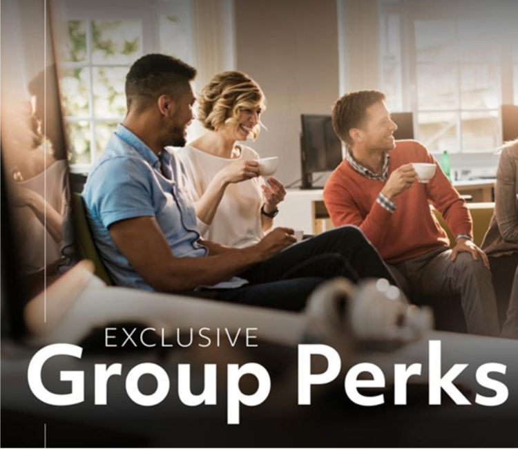 A group of people laughing while they drink coffee. There is text on-image that says, "Exclusive Group Perks."