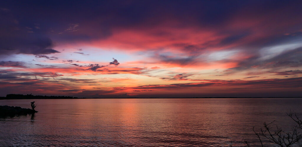 People fishing at sunset